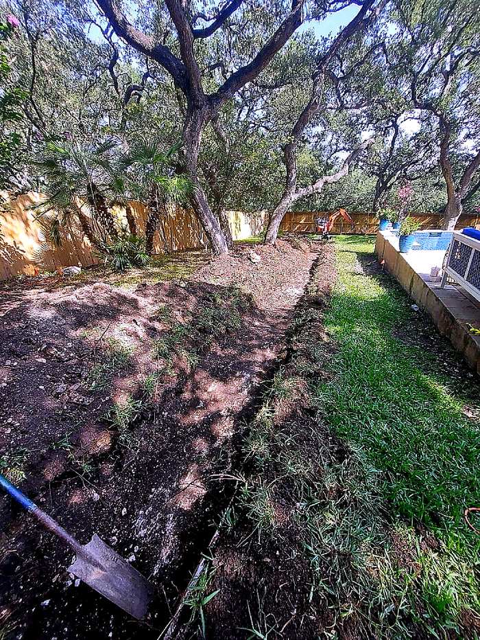 Backyard trench for a water line replacement at a San Antonio home